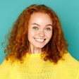 Customer Amelia Robinson wearing SkyPositive hoodie giving five star feedback